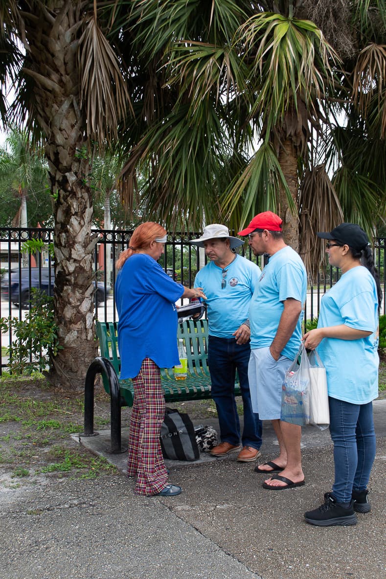 Volunteers bringing aid to a family in a park