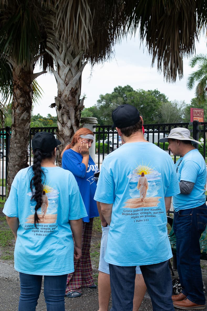 Volunteers accompanying a member of the community