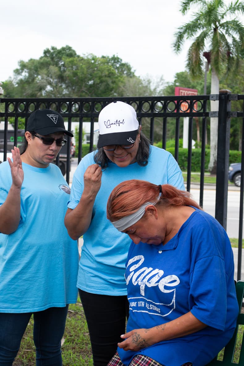 Volunteers accompanying a woman in the community