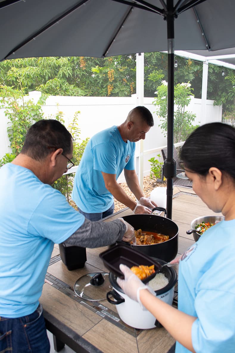 Volunteers serving food to the community